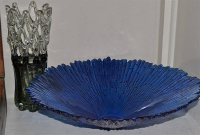 Lot 242 - A large blue art glass bowl and smoky glass vase (2)