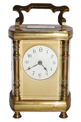 Lot 59 - Brass cased bow sided carriage timepiece,...