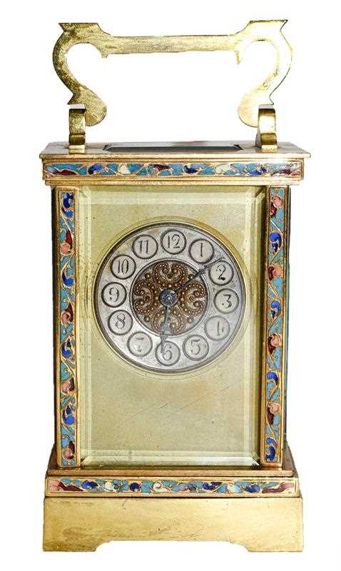 Lot 61 - A brass and champleve enamel carriage...