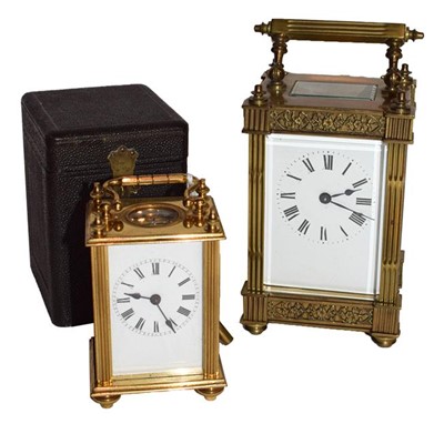 Lot 176 - Brass carriage timepiece in travelling case,...