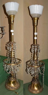 Lot 348 - A pair of gilt metal lustre drop table lamps...