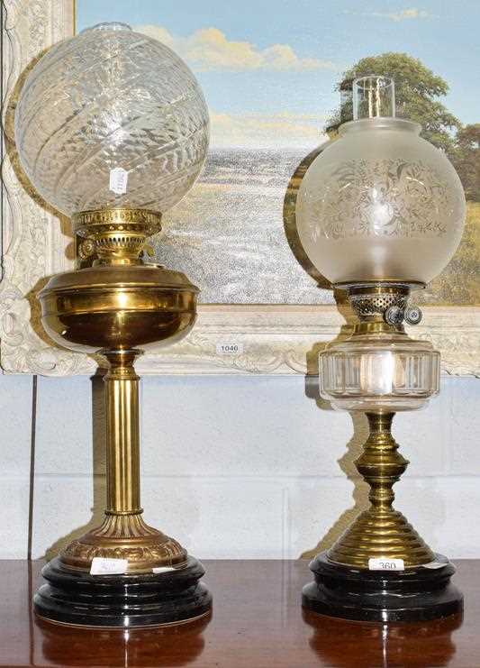 Lot 360 - Two Victorian brass oil lamps with glass...