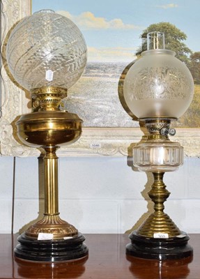 Lot 360 - Two Victorian brass oil lamps with glass...