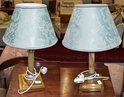 Lot 374 - A pair of brass and onyx table lamps, with...