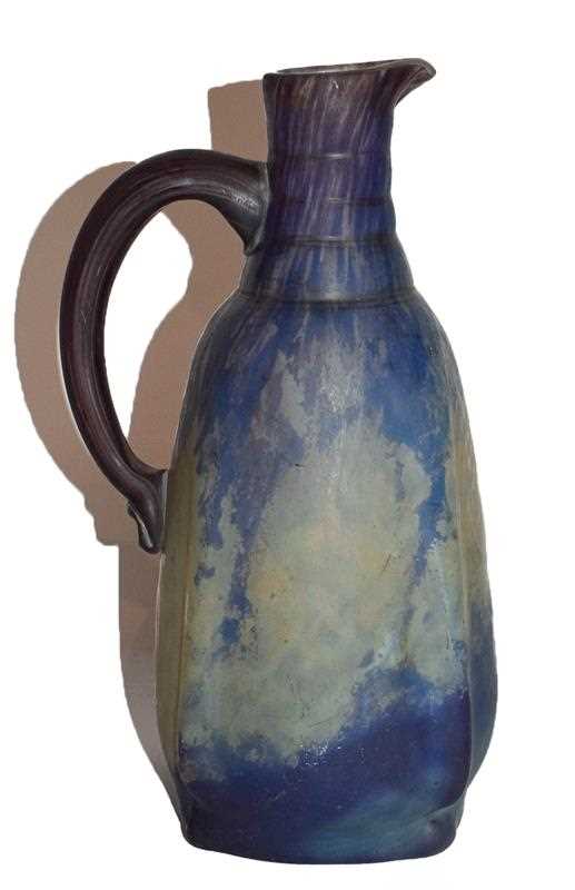 Lot 54 - A Daum Nancy glass jug, mottled purple and...