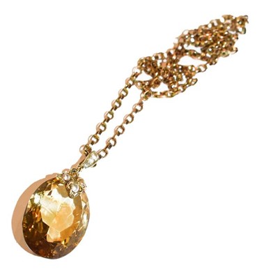 Lot 222 - A citrine and split pearl pendant on chain,...