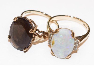 Lot 224 - A 9 carat gold smoky quartz ring, finger size...
