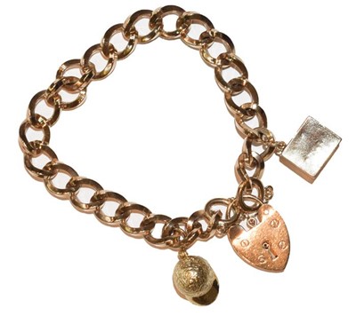Lot 248 - A curb link bracelet, stamped '375', hung with...