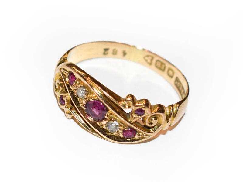 Lot 379 - An 18 carat gold ruby and diamond ring, finger...