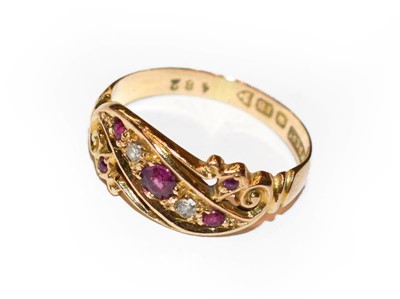 Lot 379 - An 18 carat gold ruby and diamond ring, finger...