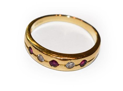 Lot 381 - An 18 carat gold ruby and diamond five stone...