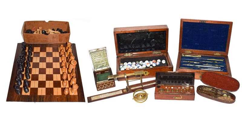 Lot 128 - A 19th century carved and turned wooden chess...