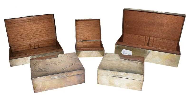 Lot 83 - Five various silver cigarette-cases, each wood...