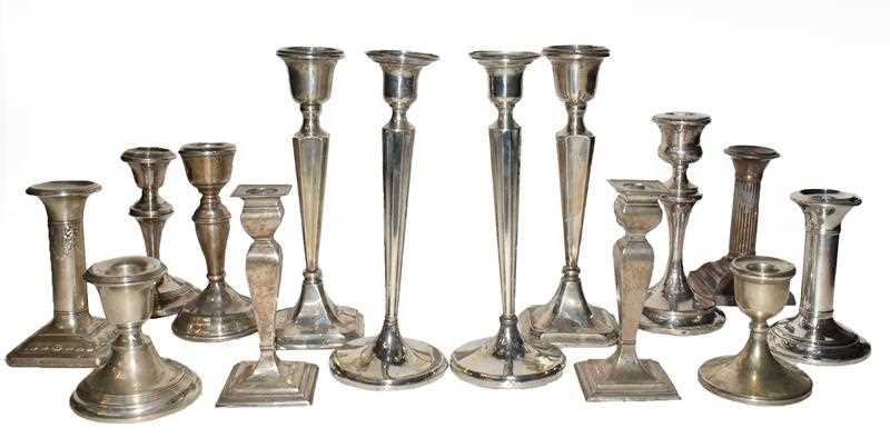 Lot 90 - A collection of assorted silver candlesticks,...