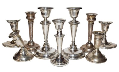 Lot 92 - A collection of assorted silver candlesticks,...