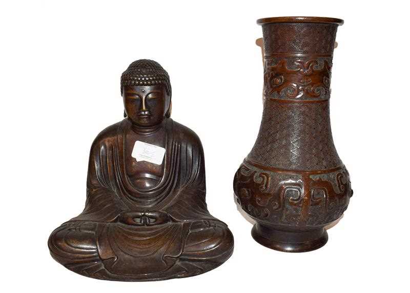 Lot 36 - A Chinese bronze statue of a seated Buddha,...