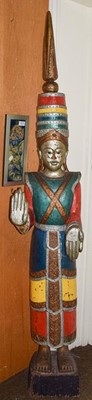 Lot 329 - An Eastern painted and carved wooden figure in...