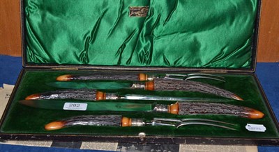 Lot 282 - A Victorian five piece antler handled carving set