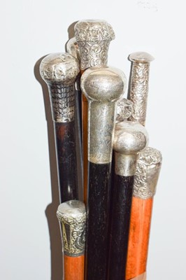 Lot 332 - Ten walking canes, some with ebonised sticks,...