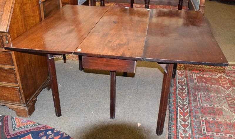 Lot 1234 - A 19th century mahogany gateleg dining table,...