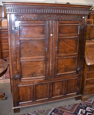 Lot 1237 - A 17th century joined oak press cupboard with...