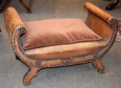 Lot 1240 - A leather upholstered X frame stool with brass...