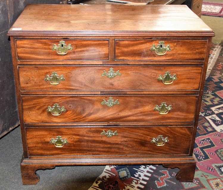 Lot 1245 - A George III mahogany four-height chest of...