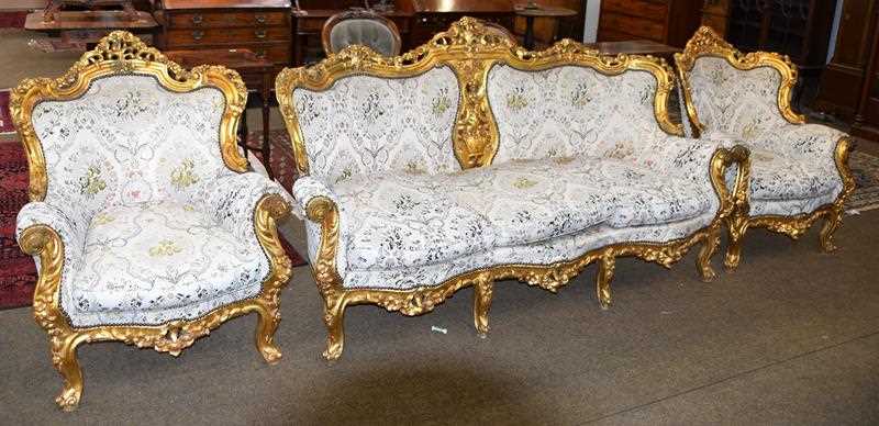 Lot 1261 - A 20th century Louis XV style giltwood three...