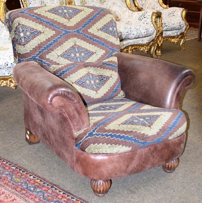 Lot 1263 - A Chiro armchair with tabriz and hide...