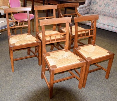 Lot 1266 - A set of five George III oak dining chairs,...