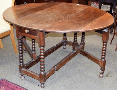 Lot 1303 - An 18th century double gateleg table, 143cm by...
