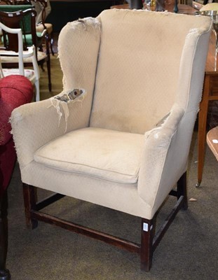 Lot 1340 - A 19th century wingback armchair (a.f.)