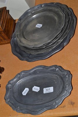 Lot 301 - Fourteen assorted pewter plates with shaped rims