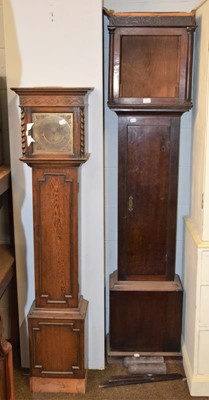 Lot 1217 - An Art Deco oak chiming small longcase clock,...
