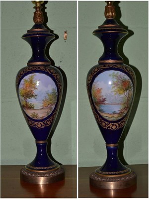 Lot 310 - Pair of blue baluster vases converted to lamps on gilt metal bases