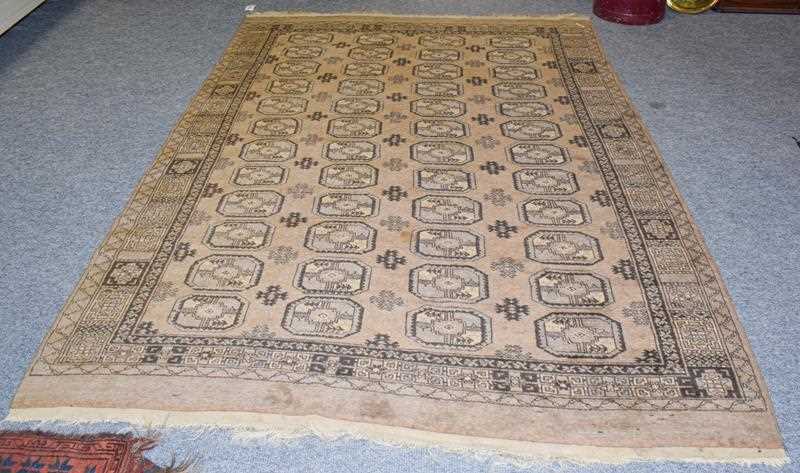 Lot 1154 - Afghan rug, the field with four columns of...