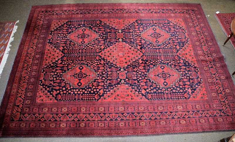 Lot 1284 - Afghan Turkman carpet, the midnight blue field...