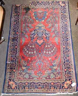Lot 1299 - Kashan prayer rug, the madder field with urn...