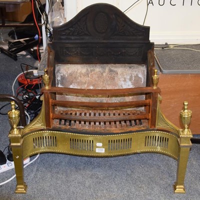 Lot 1150 - A brass and cast iron fire basket in the Adams...