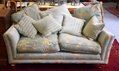 Lot 1153 - A modern three-seater settee upholstered in...
