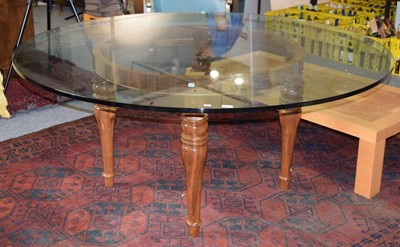 Lot 1157 - A modern circular glass top dining table...