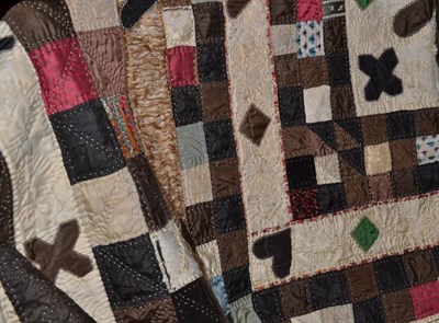 Lot 318 - A 19th century patchwork 'Wedding' Quilt worked in coloured silks and brocades within a brown...