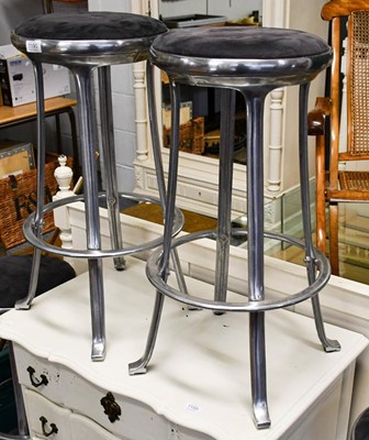 Lot 1190 - A set of four chromed bar stools