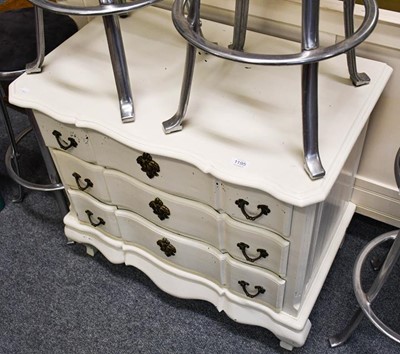 Lot 1195 - A cream painted three-height chest of drawers,...