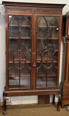 Lot 1208 - A late 19th century glazed mahogany bookcase,...