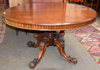 Lot 1220 - A Victorian mahogany loo table on four carved...
