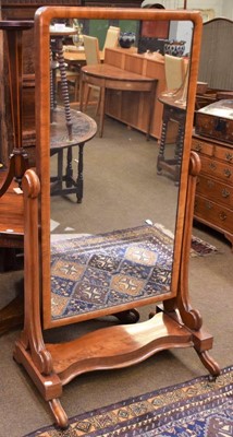 Lot 1227 - A Victorian mahogany cheval mirror moving on...