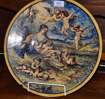 Lot 324 - An Emile Lessore Bourg la Reine faience circular charge, decorated with a woman surrounded by putti