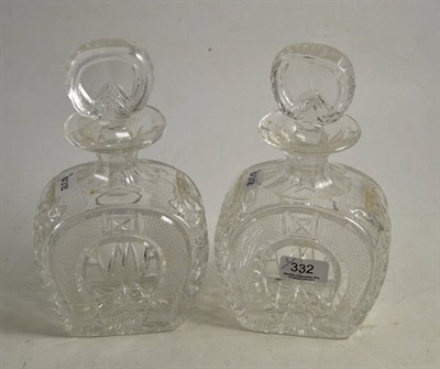 Lot 332 - A pair of horseshoe shaped decanters