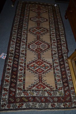 Lot 404 - Sarab runner, North West Persia, the pale camel field with a single row of hexagonal hooked...